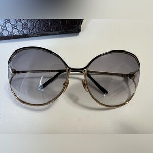 Gucci Women's Round Gold and Black Sunglasses
